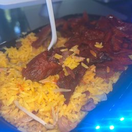 a plate of rice and meat a plate of rice and meat