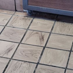 KFC - Dining room floor...the black stuff is actual sticky buildup of dirt and who knows what else