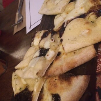 Zizzi - Incredible starter--warm, soft pita-like bread with caramelized onions, cheese, and olive oil. So much flavor - Pizza Near Me - Newcastle Upon Tyne, NET Zizzi - Incredible starter--warm, soft pita-like bread with caramelized onions, cheese, and olive oil. So much flavor - Pizza Near Me - Newcastle Upon Tyne, NET
