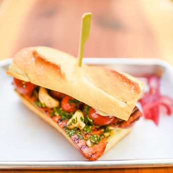 Inner Sanctum Cellars - Smokey Linguica on a toasted Sourdough Baguette with blistered Tomatoes, fresh Chimichurri, roasted Garlic, and Pickled Onions - Wine Tasting Room Near Me - Sonora, California Inner Sanctum Cellars - Smokey Linguica on a toasted Sourdough Baguette with blistered Tomatoes, fresh Chimichurri, roasted Garlic, and Pickled Onions - Wine Tasting Room Near Me - Sonora, California