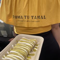 Toma Tu Tamal - Chicken tamale topped with sour cream and green salsa