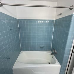 Blackburn Refinishing - This is the 1960s blue before James and Blackburn Refinishing re-Glazed our hall bathroom....