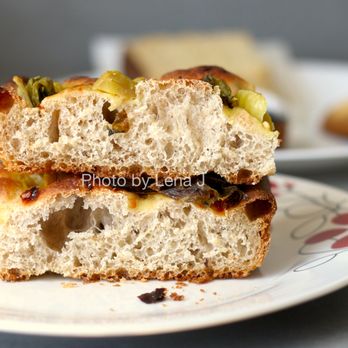 Year Of The Snake - Inside of Focaccia w/ Pickled Mustard Greens and Chili Paste ($5) - great! Mix-ins go really well with the focaccia. - Bakeries Near Me - Berkeley, California Year Of The Snake - Inside of Focaccia w/ Pickled Mustard Greens and Chili Paste ($5) - great! Mix-ins go really well with the focaccia. - Bakeries Near Me - Berkeley, California