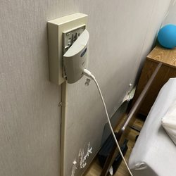 Elmhurst Extended Care Center - This is the call button and other things behind the bed.