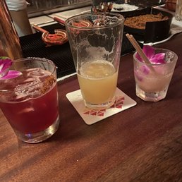 three cocktails on the bar
