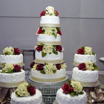 Iram's Reception Hall - Picture was taken before the decoration on the table behind the cake was placed. - Venues & Event Spaces Near Me - Pasadena, Texas