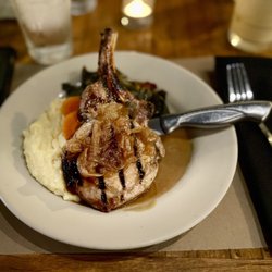 Old Bull Tavern - Apple cider pork chop with collard greens and polenta.