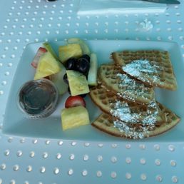 Waffles, fruit, and hazelnut spread.