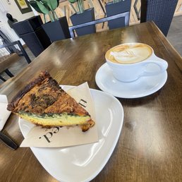 Spinach and cheddar quiche with an almond milk cappuccino sweetened with house-made vanilla syrup.