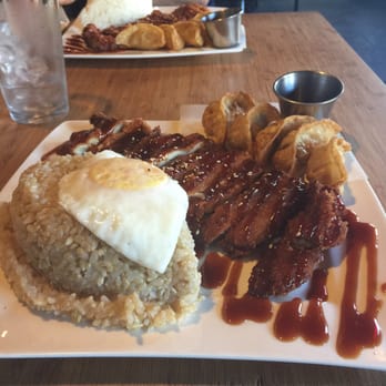 Itadakimasu - Chicken katsu and gyoza with brown and an egg on top - Korean Near Me - Seattle, Washington
