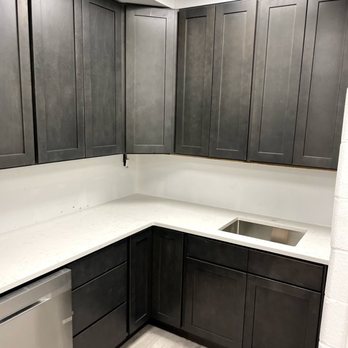 Galgano Construction - a kitchen with white countertops - General Contractors Near Me