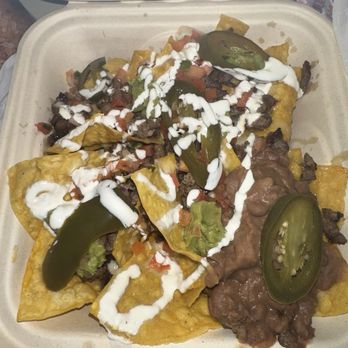Fletch's Taqueria - The trash Super Nachos I received with barely any toppings for $13 - Tacos Near Me - San Mateo, California Fletch's Taqueria - The trash Super Nachos I received with barely any toppings for $13 - Tacos Near Me - San Mateo, California