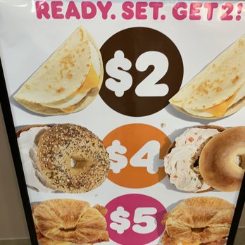 Dunkin' -  a sign with a variety of doughnuts - Coffee & Tea Near Me - Madera, California