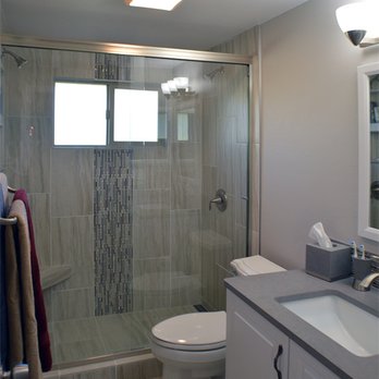 Untamed Construction - a bathroom with a shower and toilet - General Contractors Near Me