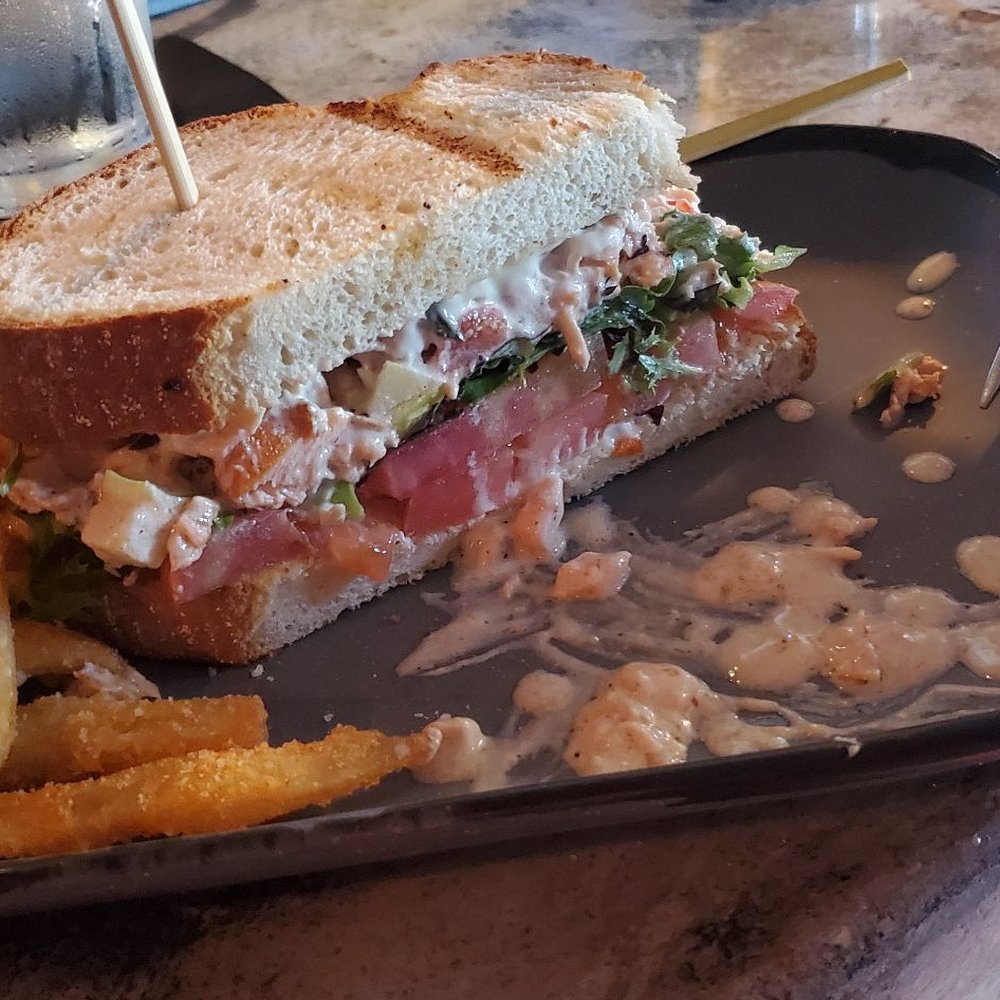 The Stubborn Mule - Smashed Salmon sandwich...first half already eaten - New American Near Me - Orlando, Florida The Stubborn Mule - Smashed Salmon sandwich...first half already eaten - New American Near Me - Orlando, Florida