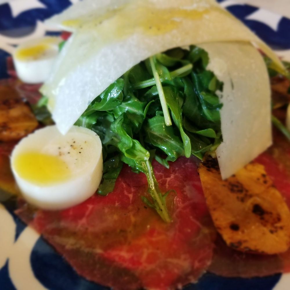 Caffe Milano - Carpaccio with aged parmesan, hearts of palm, grilled peach and arugula - Italian Near Me - North Kingstown, Rhode Island