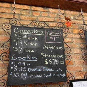 Midnite Confection's Cupcakery - a menu on a brick wall - Bakeries Near Me - Baltimore, Maryland