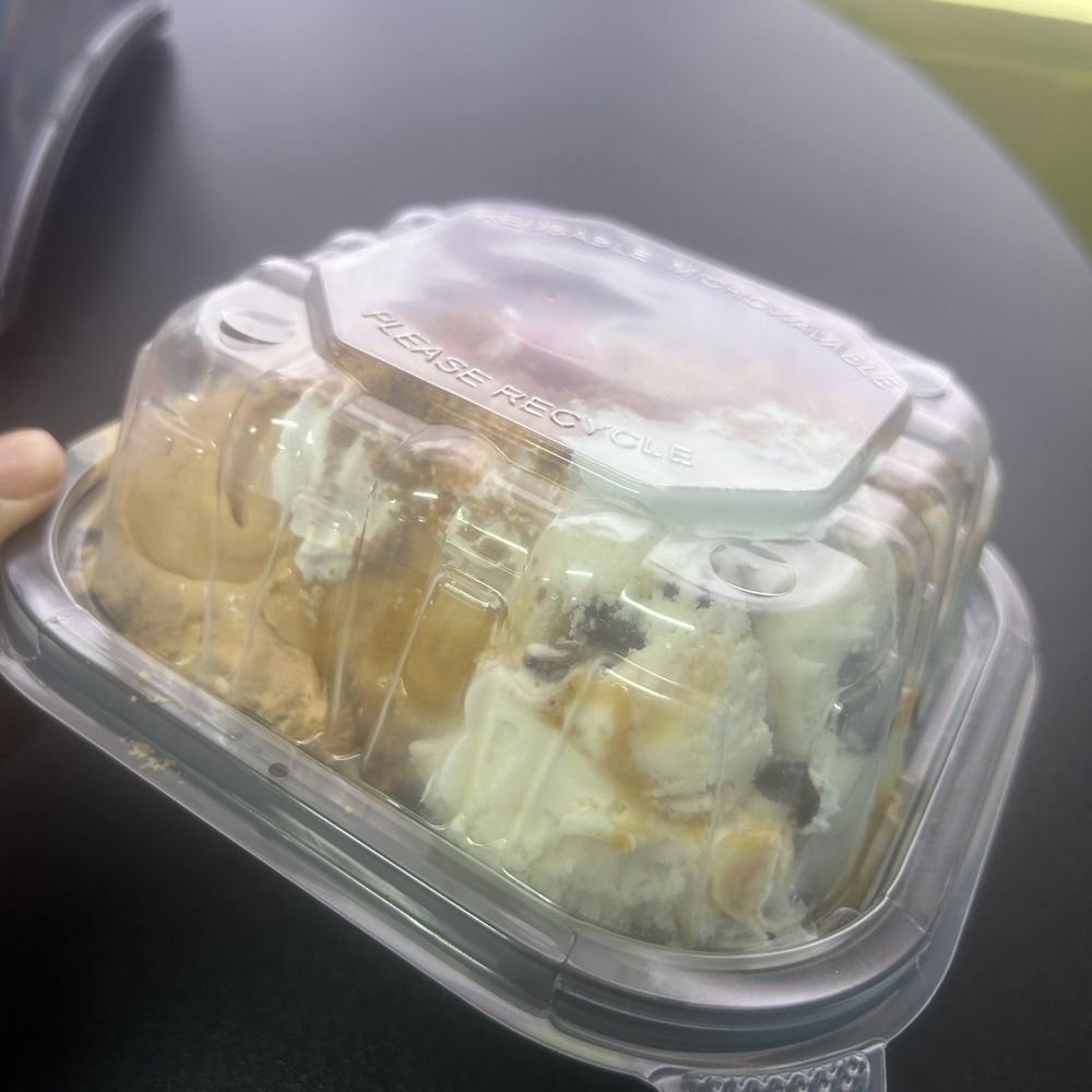 Angel Cakes Creamery - a hand holding a plastic container - Ice Cream & Frozen Yogurt Near Me - Anniston, Alabama