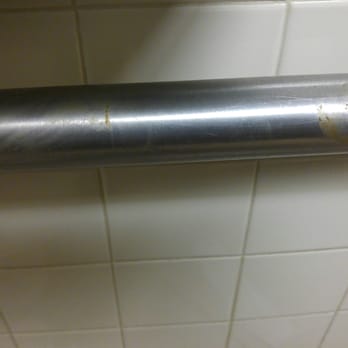 Chuck E. Cheese - Feces dried up on wall and metal bar in the bathroom - Pizza Near Me - Greensboro, North Carolina