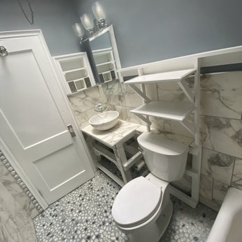 Safa the Pro Con - a bathroom with a toilet and sink - General Contractors Near Me Safa the Pro Con - a bathroom with a toilet and sink - General Contractors Near Me