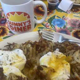 Hash browns and poached eggs with coffee Hash browns and poached eggs with coffee