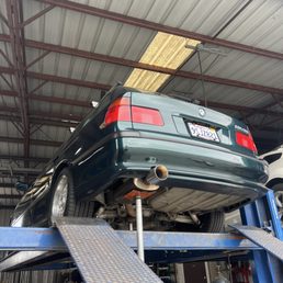 Our Dinan 5 Touring on the lift for a quick resonator replacement. Our Dinan 5 Touring on the lift for a quick resonator replacement.