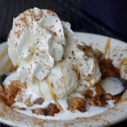 Flaherty's Three Flags Tavern & Grill - Warm Apple crumb cobbler with vanilla ice cream, whipped cream and cinnamon sprinkled on top. Large portion to share.