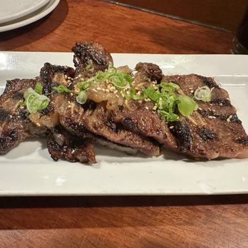 Umi Sake House - GARLIC SHORT RIBS beef short ribs marinated in garlic soy glaze, taro chips - Sushi Bars Near Me - Seattle, Washington Umi Sake House - GARLIC SHORT RIBS beef short ribs marinated in garlic soy glaze, taro chips - Sushi Bars Near Me - Seattle, Washington