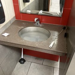 Wendy's - Smelly Clogged sink in restroom. Employees must not be washing their hands.