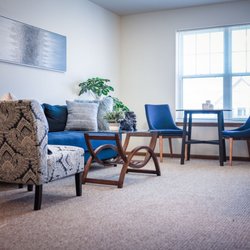 Saint Therese of Oxbow Lake - A resident apartment living room at Oxbow Lake.