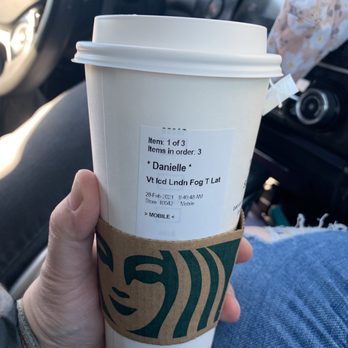 Starbucks - a person holding a cup of coffee - Coffee & Tea Near Me - Las Vegas, Nevada Starbucks - a person holding a cup of coffee - Coffee & Tea Near Me - Las Vegas, Nevada
