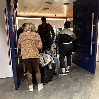 The Centurion Lounge - Line out of the door. Takes 15 minutes to get here from C Gate and now I'm heading back. What a waste of time - Airport Lounges Near Me - Dallas, Texas