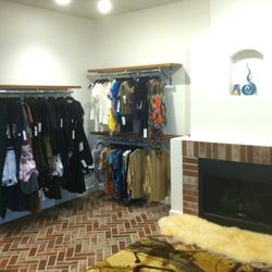 Great Expectation LLC dba Today's Clothing - Handbag, clothing, and shoe room with working fireplace