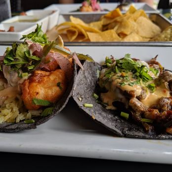 La Catrina Mexican Kitchen - Shrimp taco, carne asada taco with chips and salsa in the back. - Mexican Near Me - New Albany, Indiana