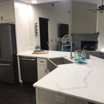 Kitchen & Bath Exchange - a kitchen with a sink, refrigerator, dishwasher, and dishwasher - Kitchen & Bath Near Me - Pinellas Park, Florida Kitchen & Bath Exchange - a kitchen with a sink, refrigerator, dishwasher, and dishwasher - Kitchen & Bath Near Me - Pinellas Park, Florida