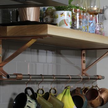 Turner & Associates - Locally sourced custom white oak shelves with hand-formed copper brackets with stainless hanging rod - Cabinetry Near Me - Saint Louis, Missouri Turner & Associates - Locally sourced custom white oak shelves with hand-formed copper brackets with stainless hanging rod - Cabinetry Near Me - Saint Louis, Missouri
