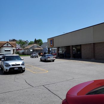ALDI - a parking lot with cars parked in it - Grocery Near Me - Milwaukee, Wisconsin ALDI - a parking lot with cars parked in it - Grocery Near Me - Milwaukee, Wisconsin