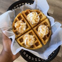 BLAK Coffee Kenosha - Sweet potato waffle featuring whip cream and caramel drizzle.