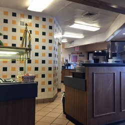 Pizza Hut - Paper on floor, and floors are filthy.
