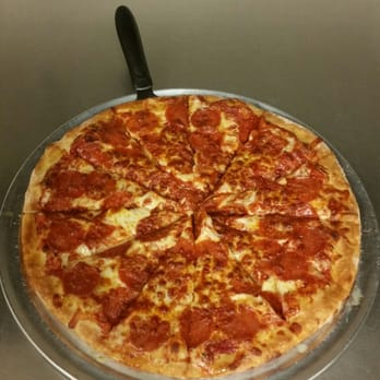 Hometown Pizza - a pepperoni pizza on a pizza pan - Pizza Near Me - Clinton, Michigan Hometown Pizza - a pepperoni pizza on a pizza pan - Pizza Near Me - Clinton, Michigan