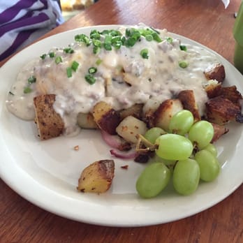 Lucky's Cafe - "Biscuits" loaded with scrambled eggs, topped with sausage gravy & fresh scallions! Yuuummmmm - Coffee & Tea Near Me - Cleveland, Ohio