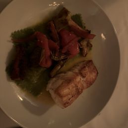 Halibut with octopus, ravioli, and artichokes.
