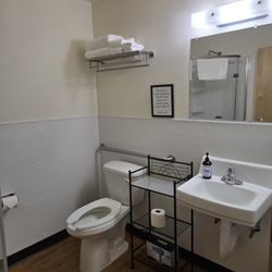 Northport Center Suites - Each Suite comes with a private bathroom, including a stand up shower stall, toilet, sink, linens, TP and shampoo, cond. & soap on request.