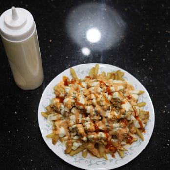Krispy Fry - a plate of fries and a bottle of ketchup - Chicken Shop Near Me - Oshawa, Ontario