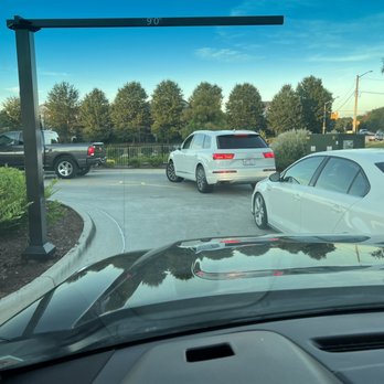 Chick-fil-A - The narrow section that backs up. Car on right had to run over curb to get through. - Chicken Shop Near Me - Wake Forest, North Carolina