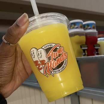 Two Hands Corn Dogs - a person holding a drink - Fast Food Near Me - Lakewood, California Two Hands Corn Dogs - a person holding a drink - Fast Food Near Me - Lakewood, California