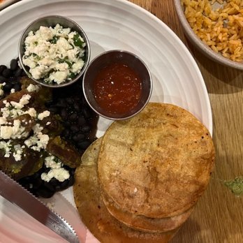 El Barrio Cantina - carnitas chile verde: confit pork butt, black beans, queso fresco, served with guacamole and sonoran flour tortillas = $18 - Mexican Near Me - Long Beach, California