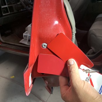 Caliber Collision - Team taking the time to ensure the prefect red! - Body Shops Near Me - Anaheim, California