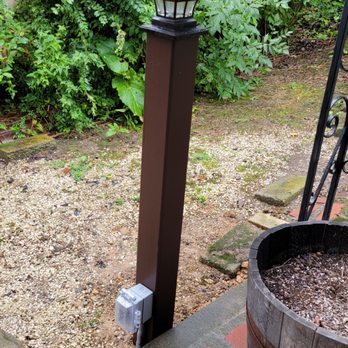 Powers Electric - Finished product with a post sleeve and solar lantern - Electricians Near Me Powers Electric - Finished product with a post sleeve and solar lantern - Electricians Near Me