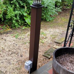 Powers Electric - Finished product with a post sleeve and solar lantern